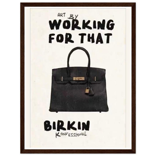 Black handbag beneath bold Working for that lettering on cream in a dark wood frame.