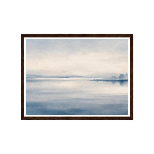 Still blue lake and a distant misty shoreline beneath a pale sky in a dark wood frame.