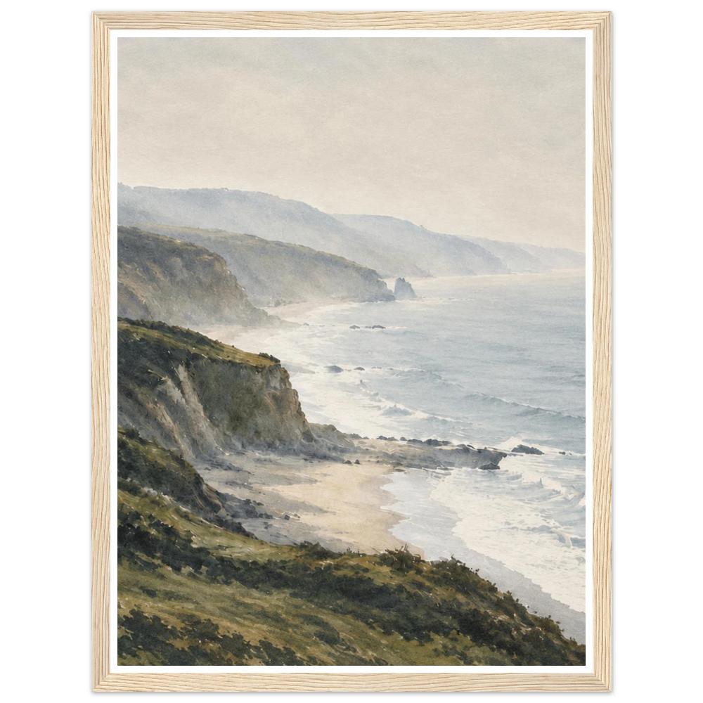 Green coastal cliffs and white surf beside a misty blue-grey sea in a natural wood frame.