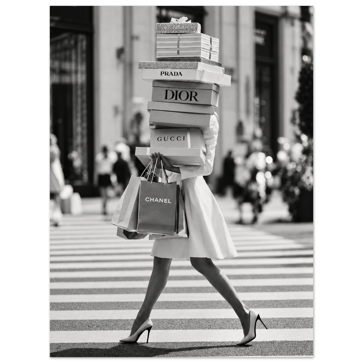 Woman crossing a street in heels carrying a tall stack of shopping boxes as an unframed poster.