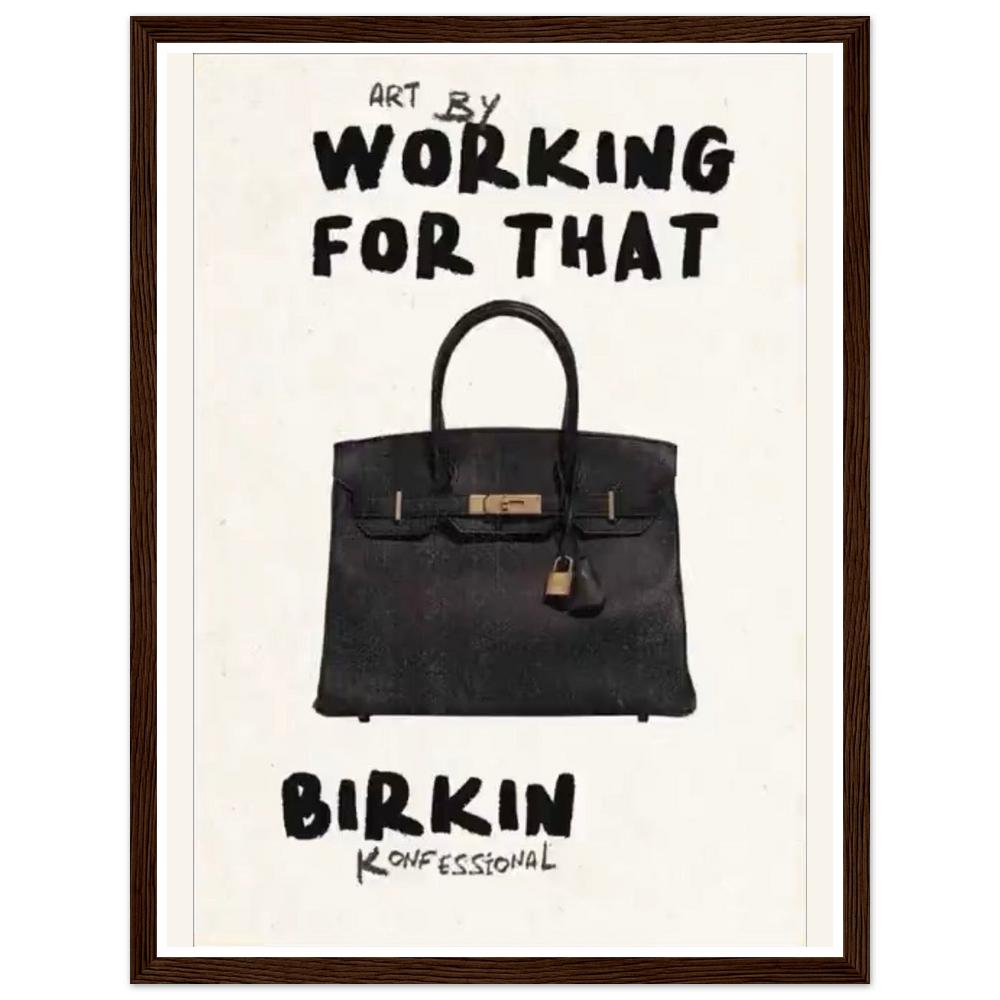 Black handbag beneath bold Working for that lettering on cream in a dark wood frame.