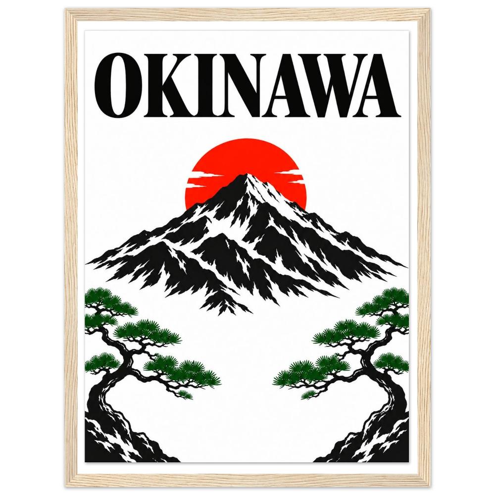 Black mountain beneath a red sun, green pine branches and bold Okinawa lettering in a natural wood frame.