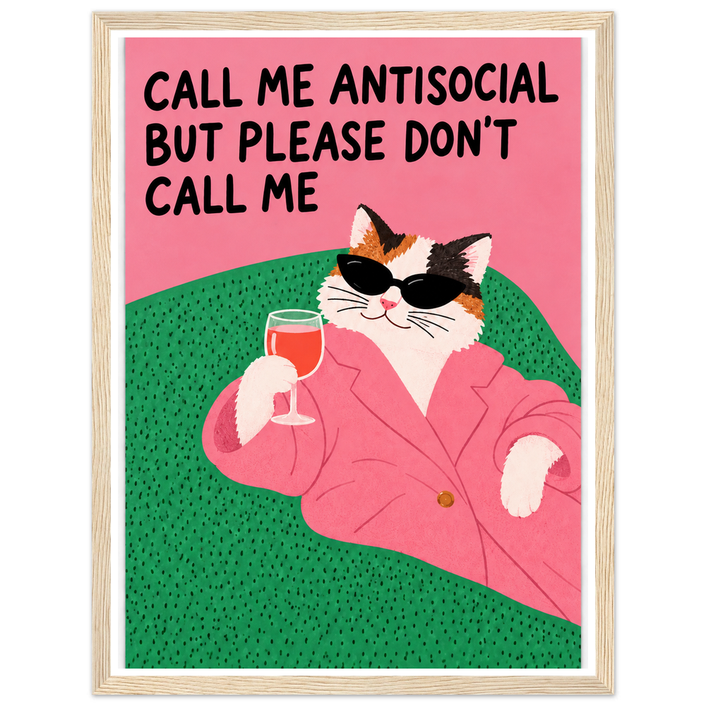 Calico cat in sunglasses and a pink blazer holding a drink, with an antisocial quote in a natural wood frame.