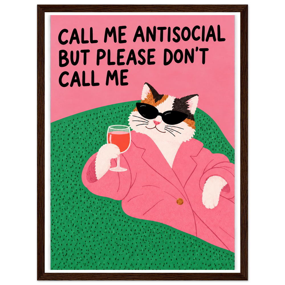 Calico cat in sunglasses and a pink blazer holding a drink, with an antisocial quote in a dark wood frame.
