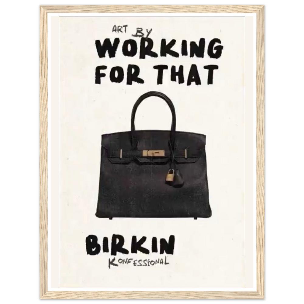 Black handbag beneath bold Working for that lettering on cream in a natural wood frame.