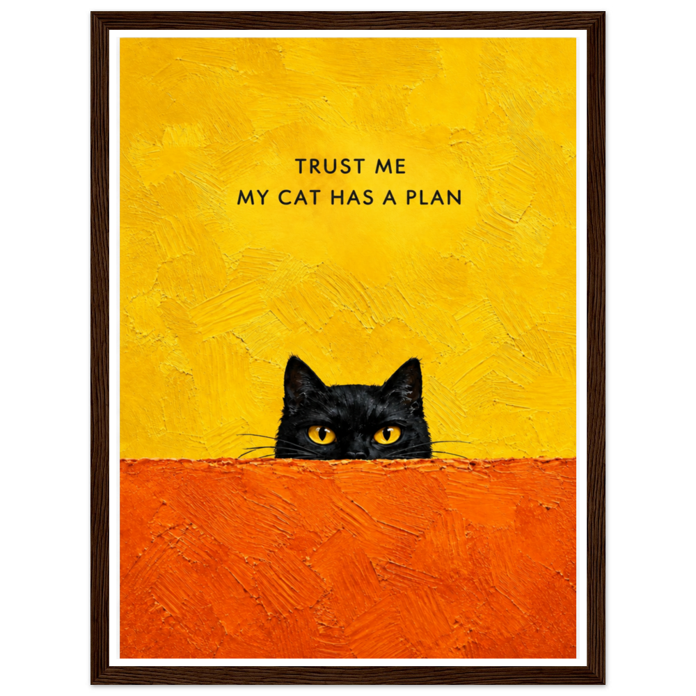 Black cat peeking over an orange ledge beneath Trust me, my cat has a plan in a dark wood frame.