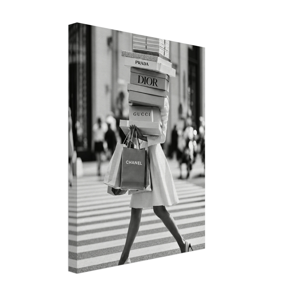 Woman crossing a street in heels carrying a tall stack of shopping boxes printed on canvas.