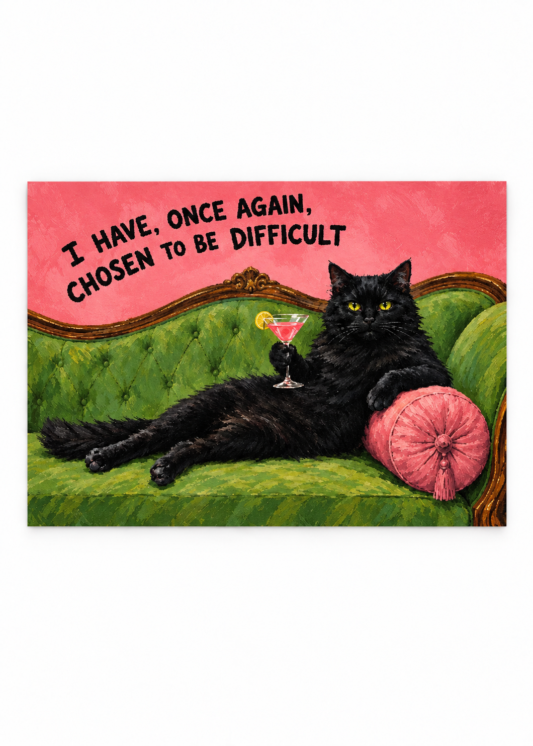 Black cat with a cocktail on a green sofa beneath a chosen to be difficult quote as an unframed poster.