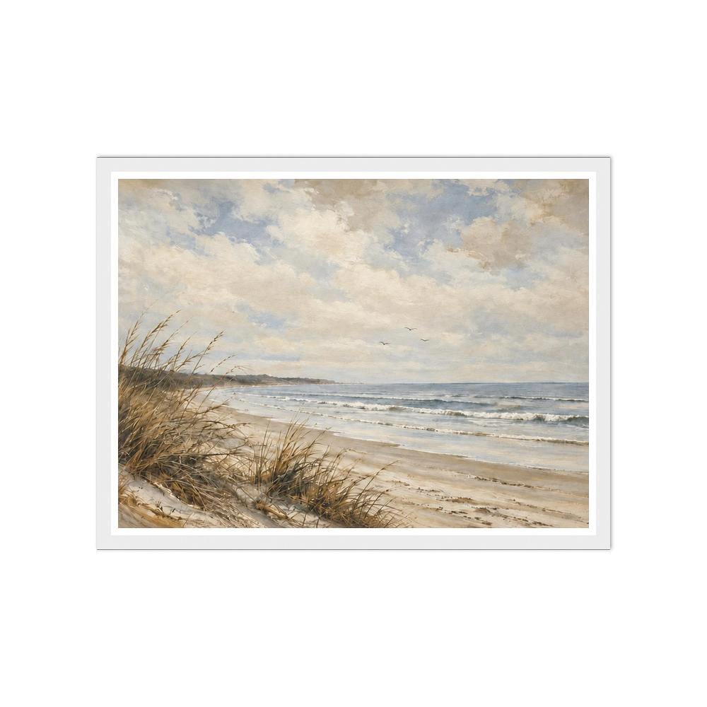 Beach grasses on sandy dunes beside gentle waves under a cloudy blue sky in a white frame.