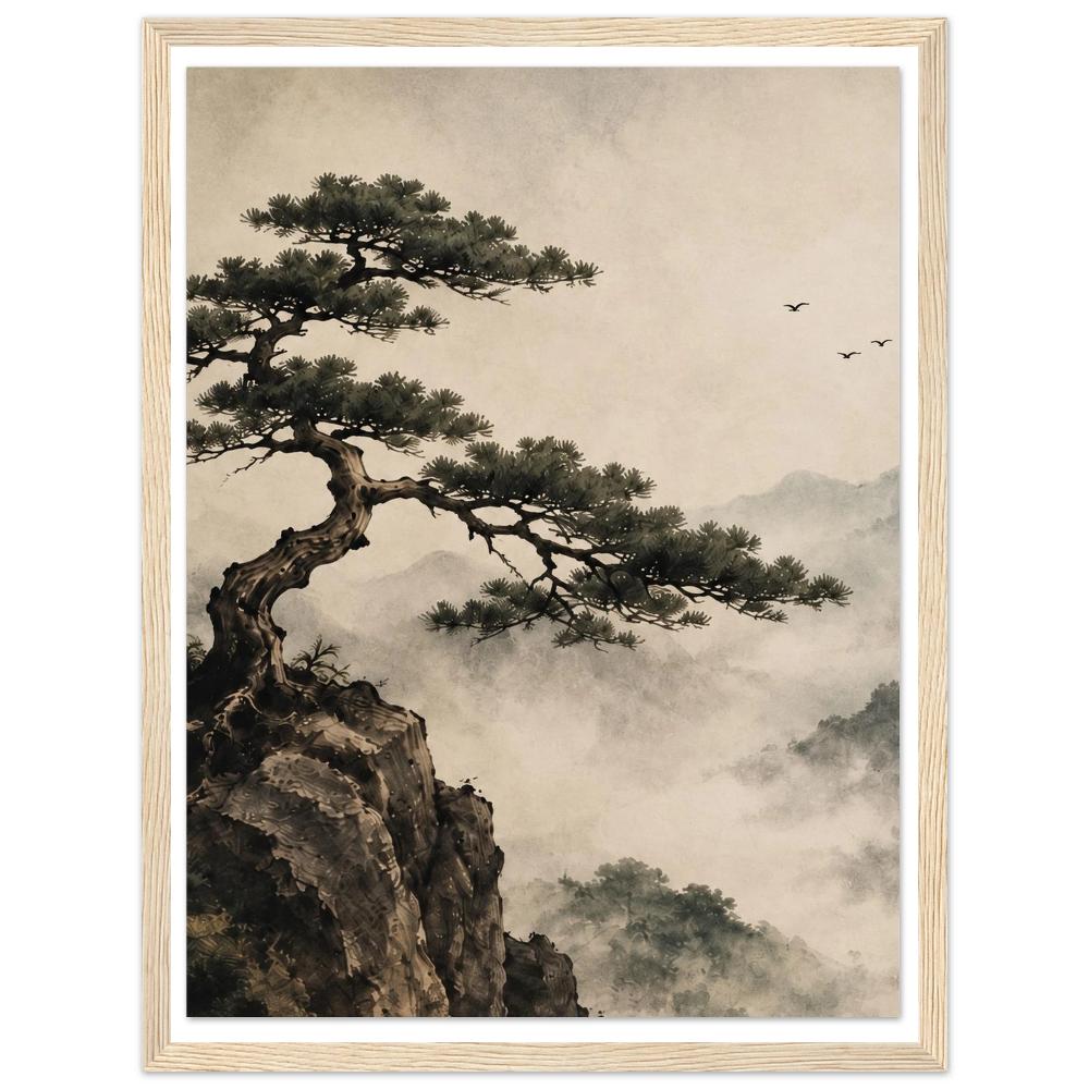 Pine tree reaching from a rocky cliff above misty mountains with birds in the sky in a natural wood frame.