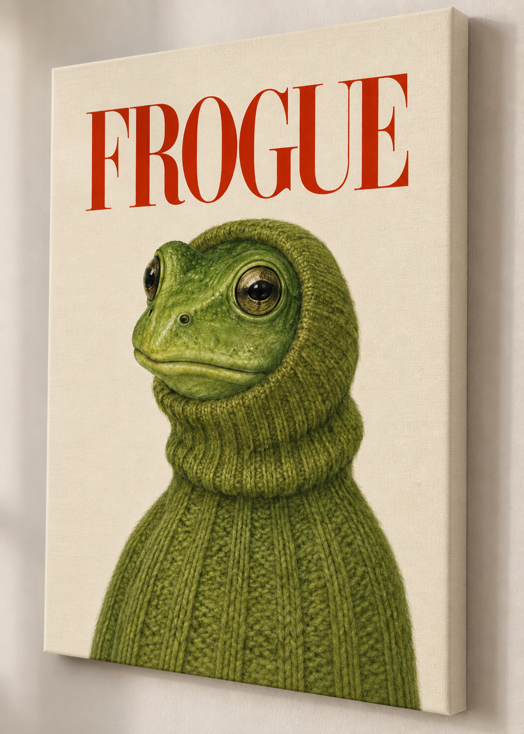 Green frog in a chunky green turtleneck beneath red FROGUE lettering on canvas, shown from an angle.