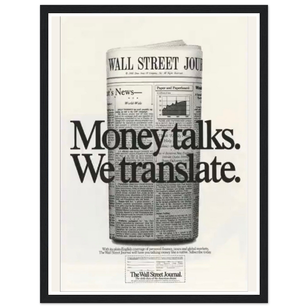 Money talks. We translate. lettering over a rolled financial newspaper in a black frame.