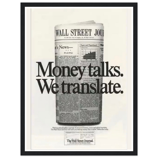Money talks. We translate. lettering over a rolled financial newspaper in a black frame.