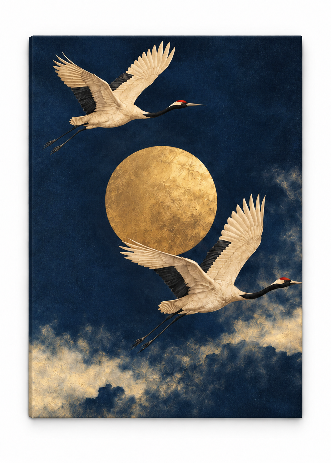 Two pale cranes flying around a golden moon above clouds in a navy sky printed on canvas.