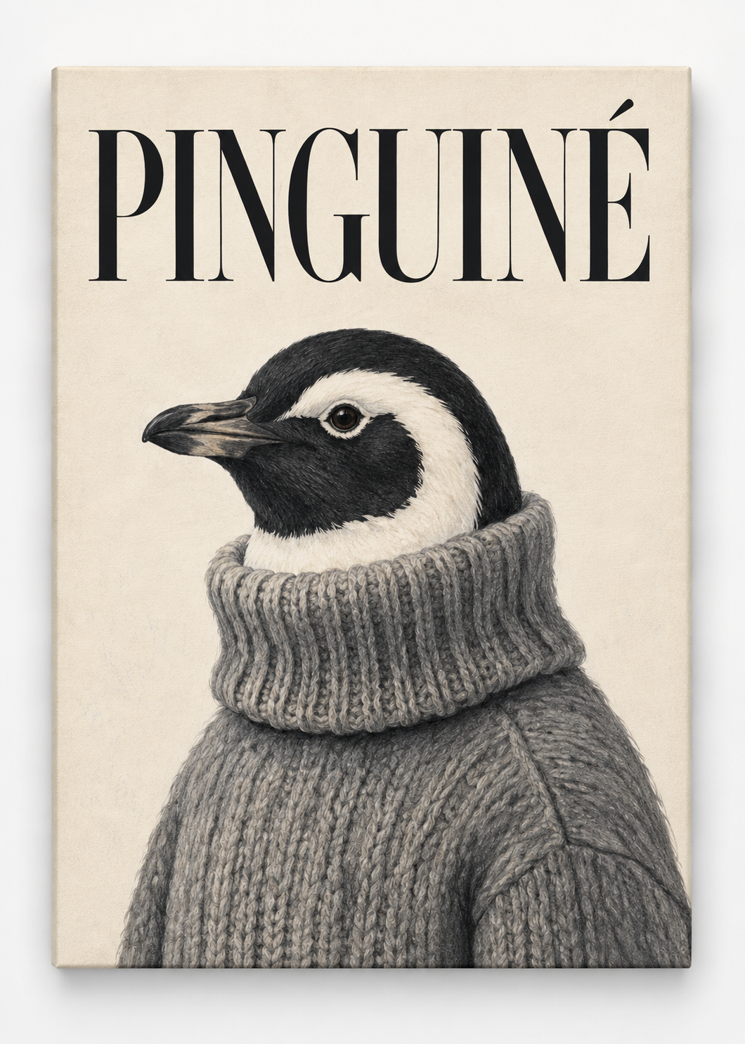 Black-and-white penguin in a grey knitted jumper beneath PINGUINÉ lettering as a canvas print.