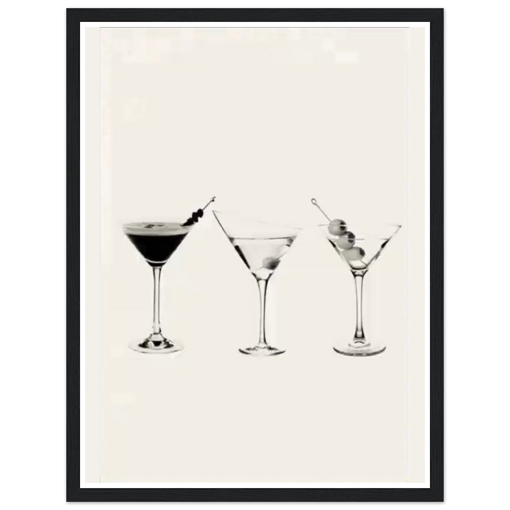 Three martini glasses with cocktail garnishes on a cream background in a black frame.